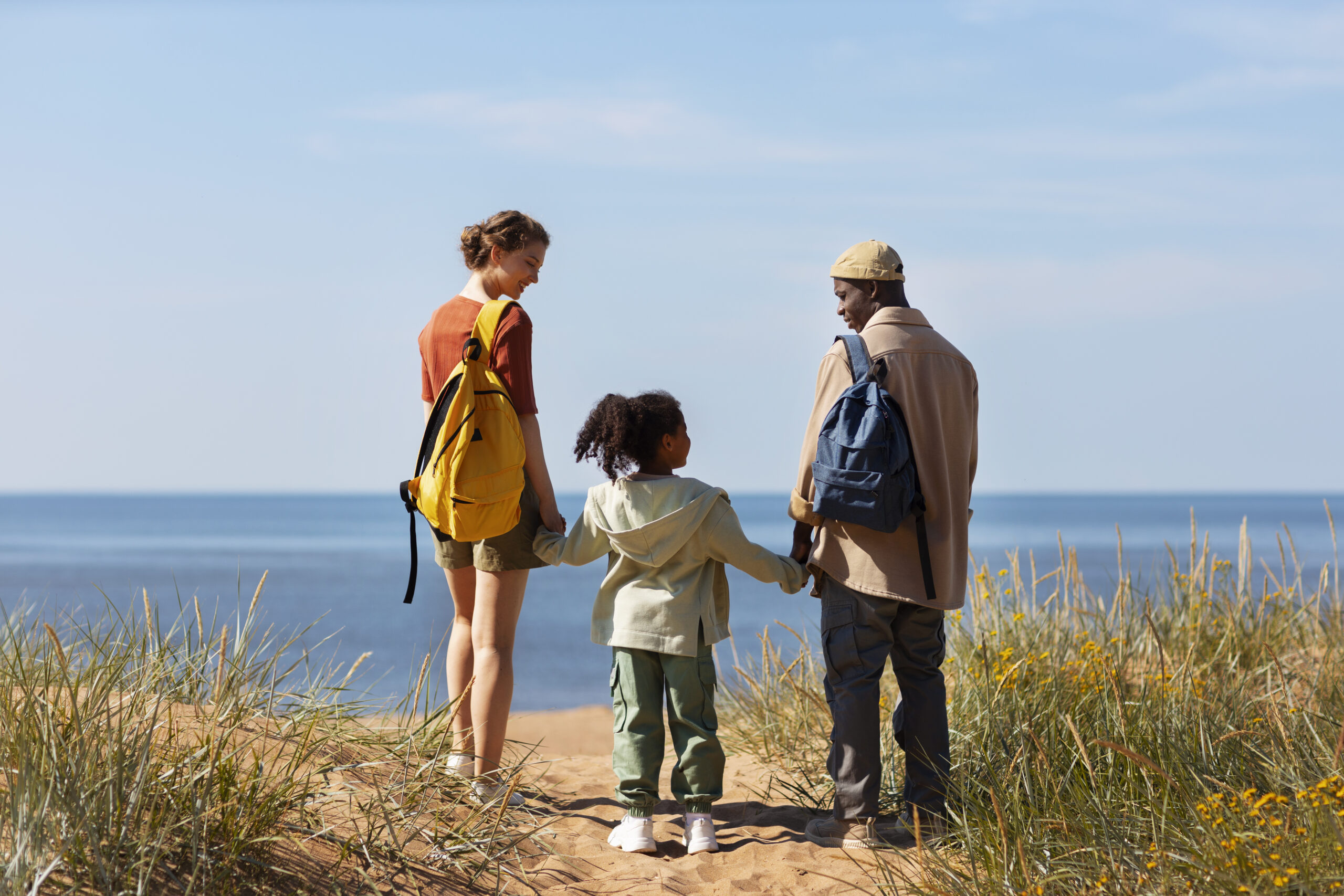Designer replacement image: family exploring a UK coastal town for Trips and Tours related