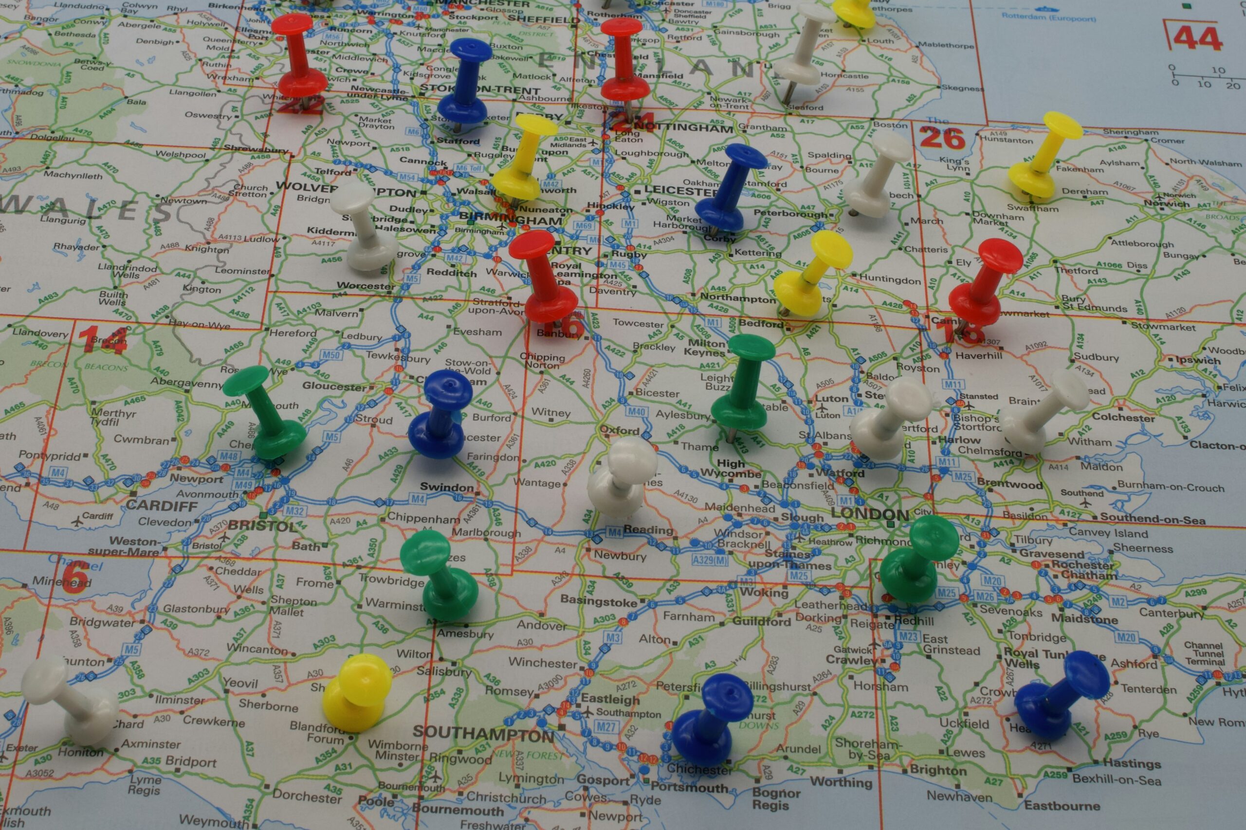 Trips and Tours family travel planning scene with UK map, summer destination notes and hol
